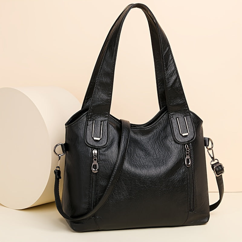 Lumi women’s classic tote bag in black with two handles, top zip, and side straps