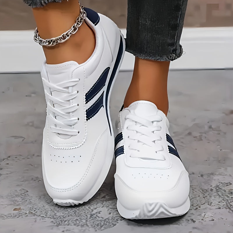 White orthopedic sneakers with navy side stripes and thick sole, lace-up
