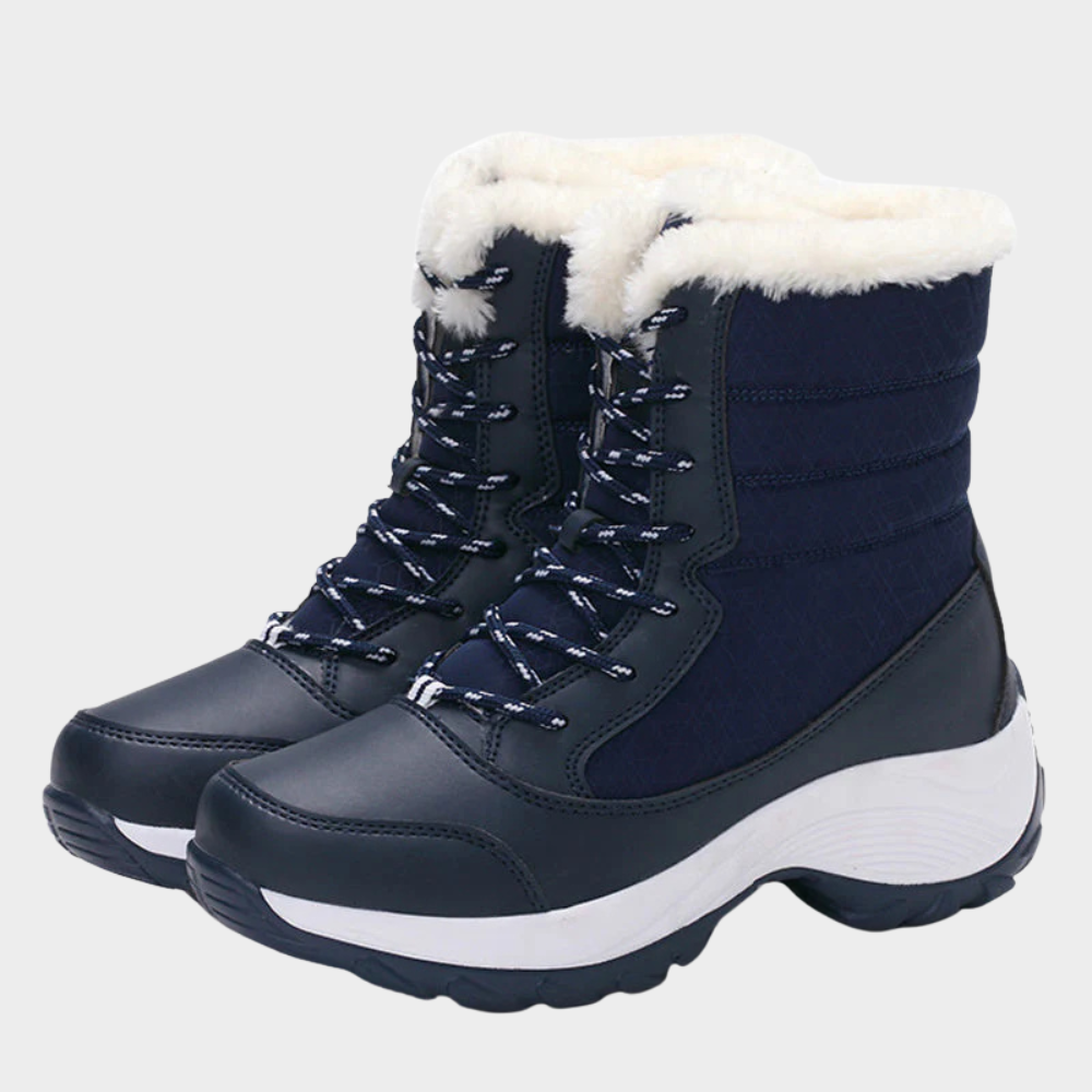Navy winter boots with lace-up front, white faux-fur collar, and chunky tread sole.