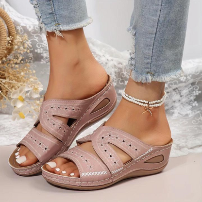 Orthopedic sandals in mauve/pink, adjustable strap and open toe with stitched detail.