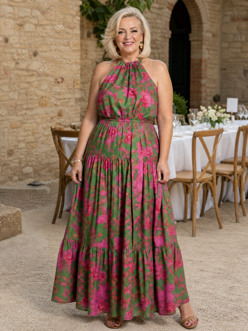 Floral halter midi dress with tiered ruffle skirt and pink flower print on green.