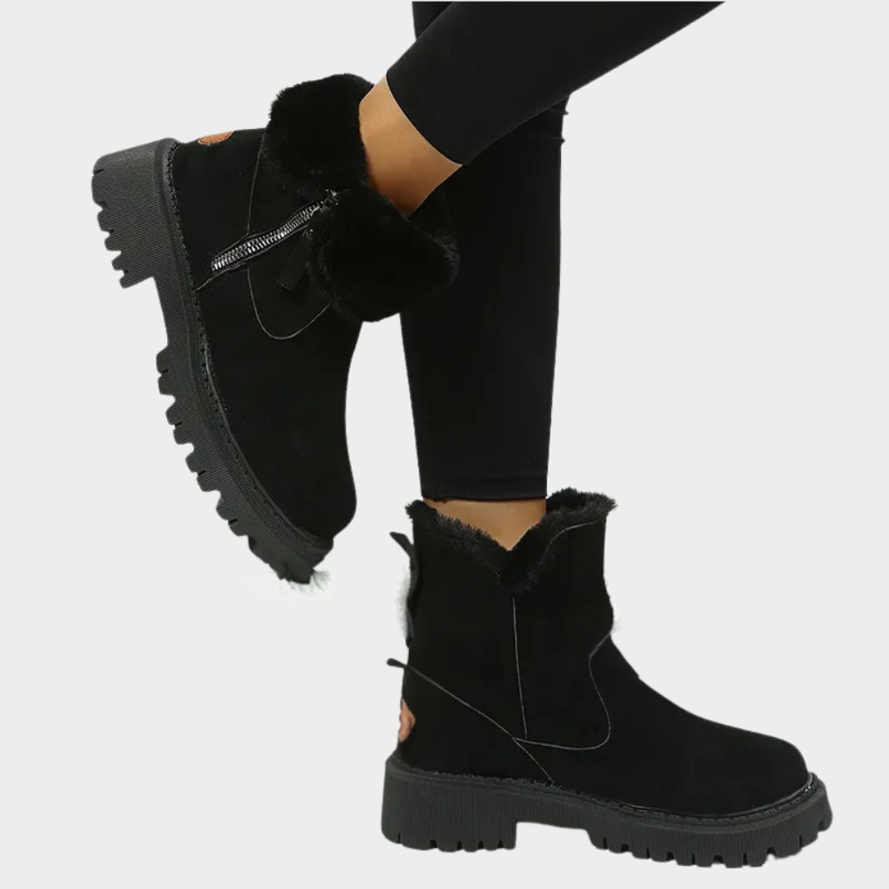 Black orthopedic boot with faux fur trim, side zipper, and treaded outsole