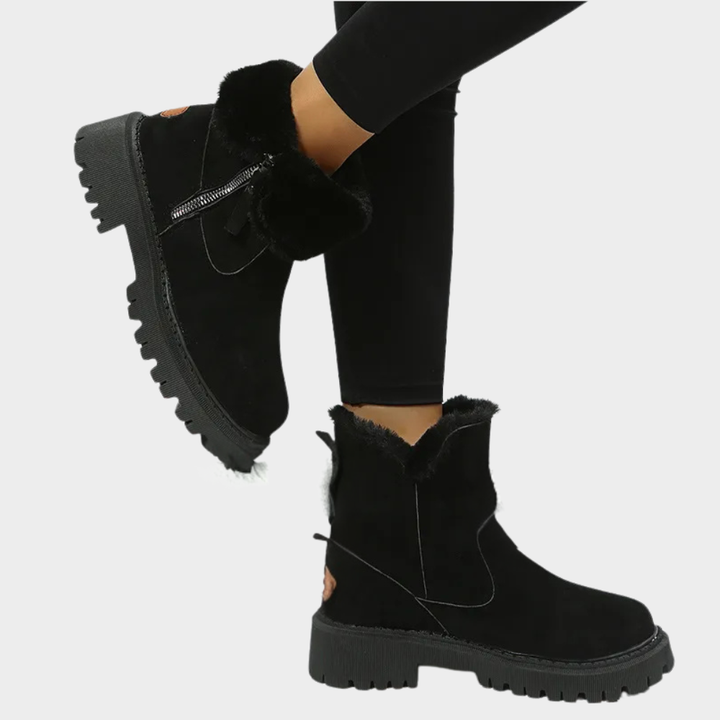 Black orthopedic boot with faux fur trim, side zipper, and treaded outsole