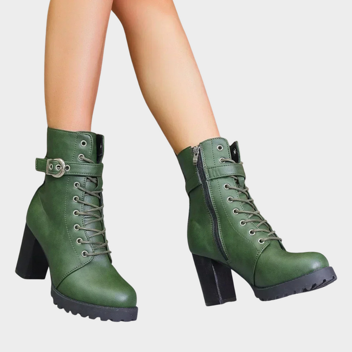 Green flared heel ankle boots with lace-up front, side zip, and chunky tread sole