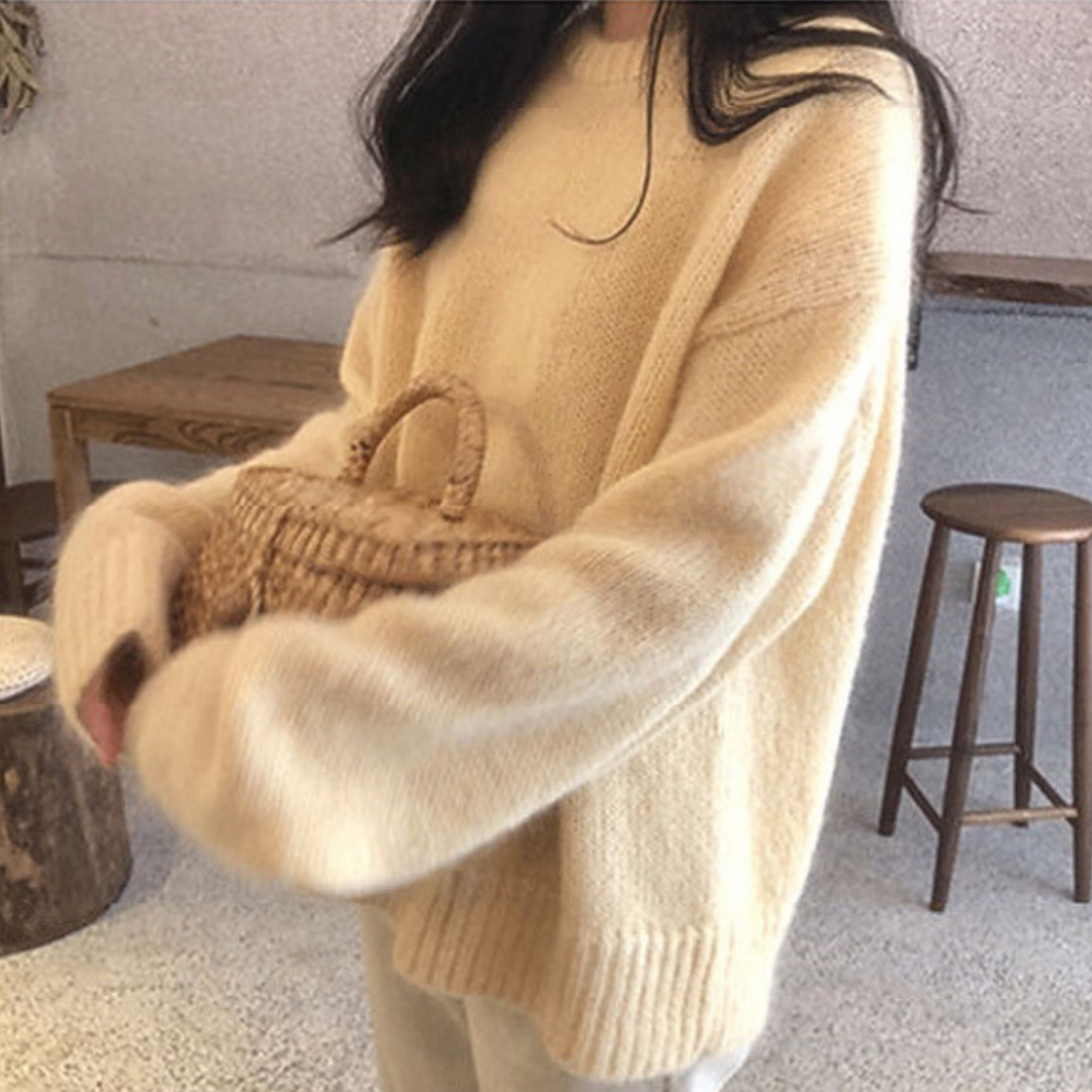 Cream casual long-sleeve sweater with round neck, ribbed cuffs, and fitted hem