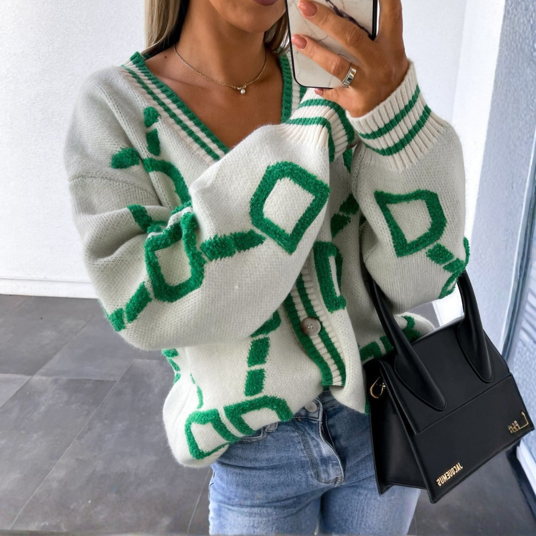 White button-down cardigan with green geometric pattern, V-neck, long sleeves, button front