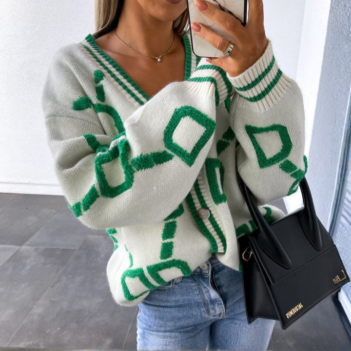 White button-down cardigan with green geometric pattern, V-neck, long sleeves, button front