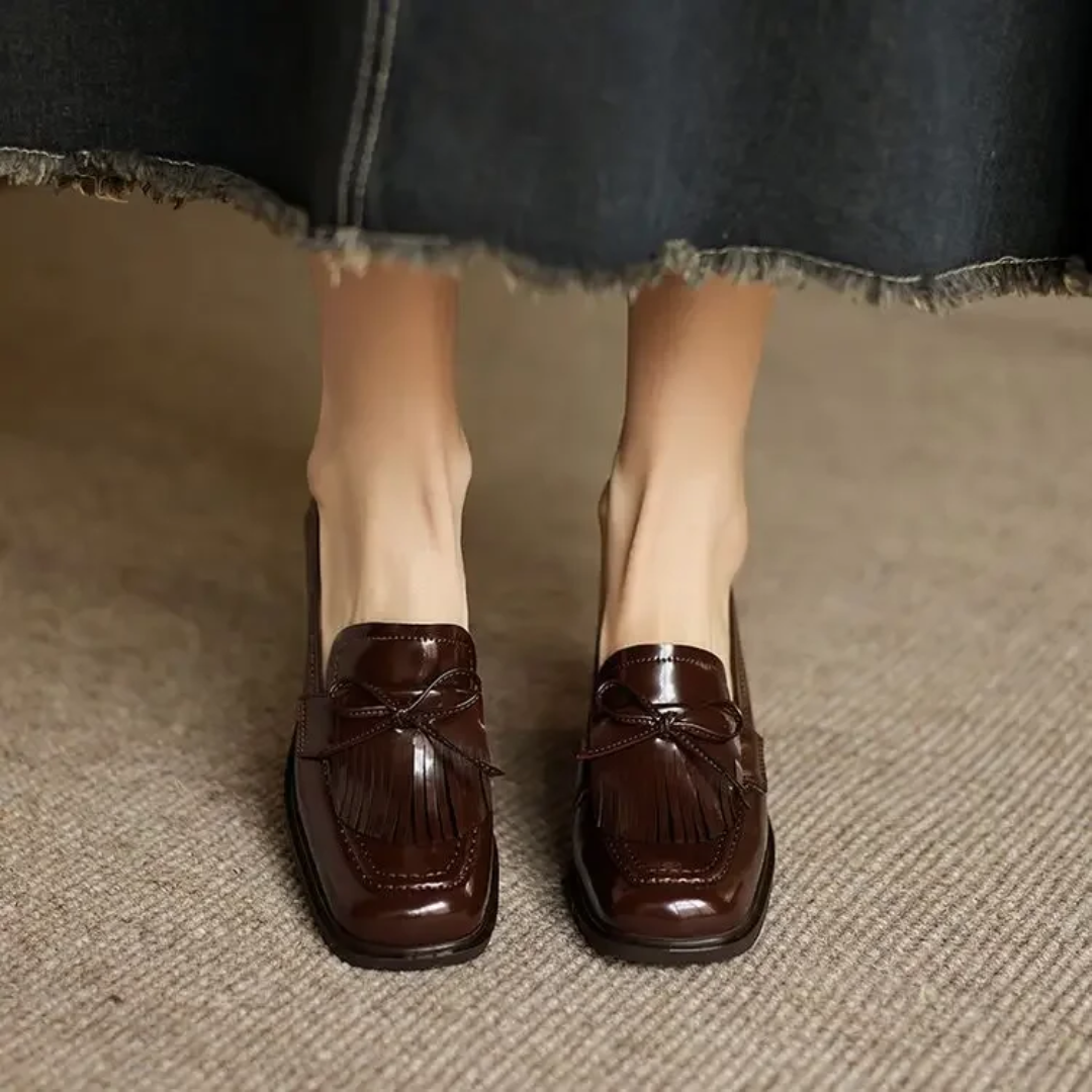 Brown loafer pumps with tassel bow detail and block heel, pair view