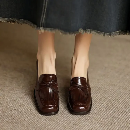 Brown loafer pumps with tassel bow detail and block heel, pair view