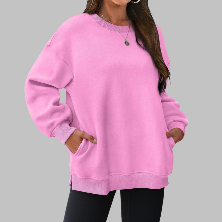 Pink oversized crewneck long sleeve sweater with ribbed cuffs and hem