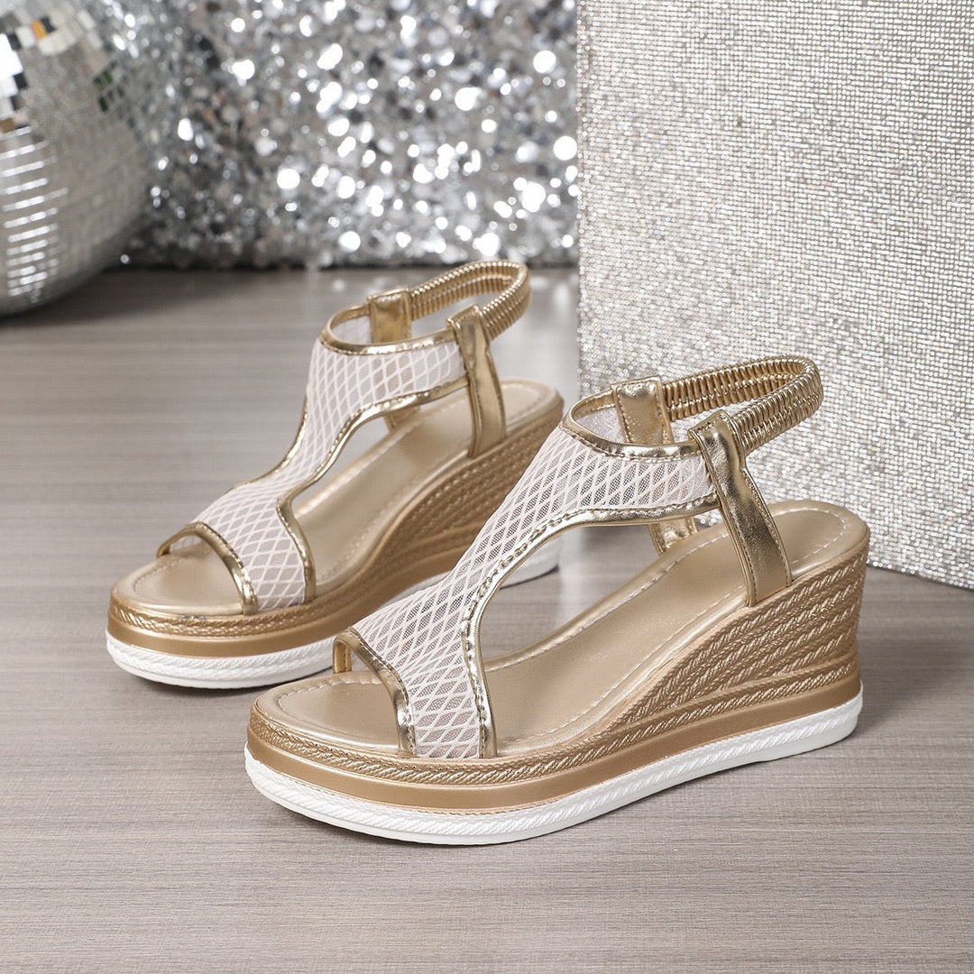Beige and gold heeled sandals with peep-toe straps and textured wedge midsole