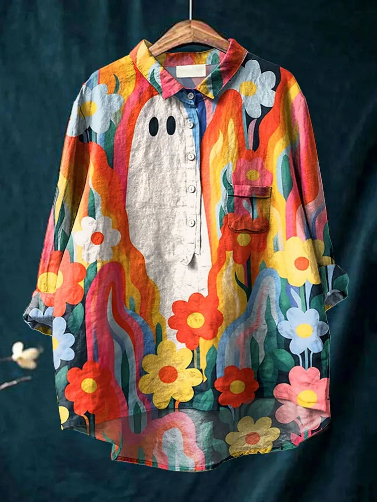 Artistic long sleeve button-up shirt with colorful floral plant print, gray front face