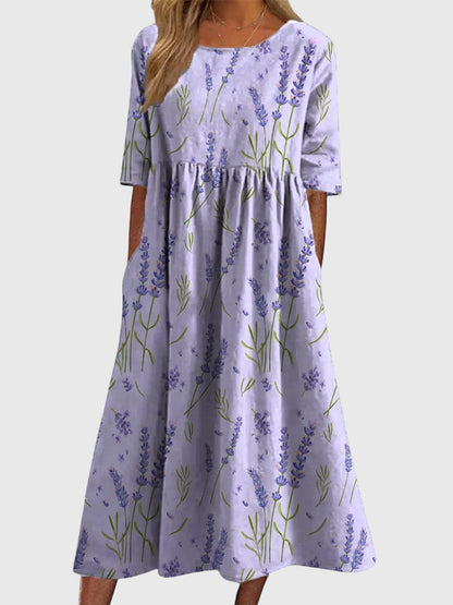 Relaxed midi dress in lavender with purple wildflower print, short sleeves, gathered skirt