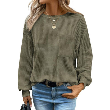 Olive green oversized long-sleeve crewneck blouse with waffle knit texture and chest pocket