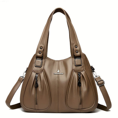 Women’s casual shoulder bag in khaki with top handles and adjustable shoulder strap.