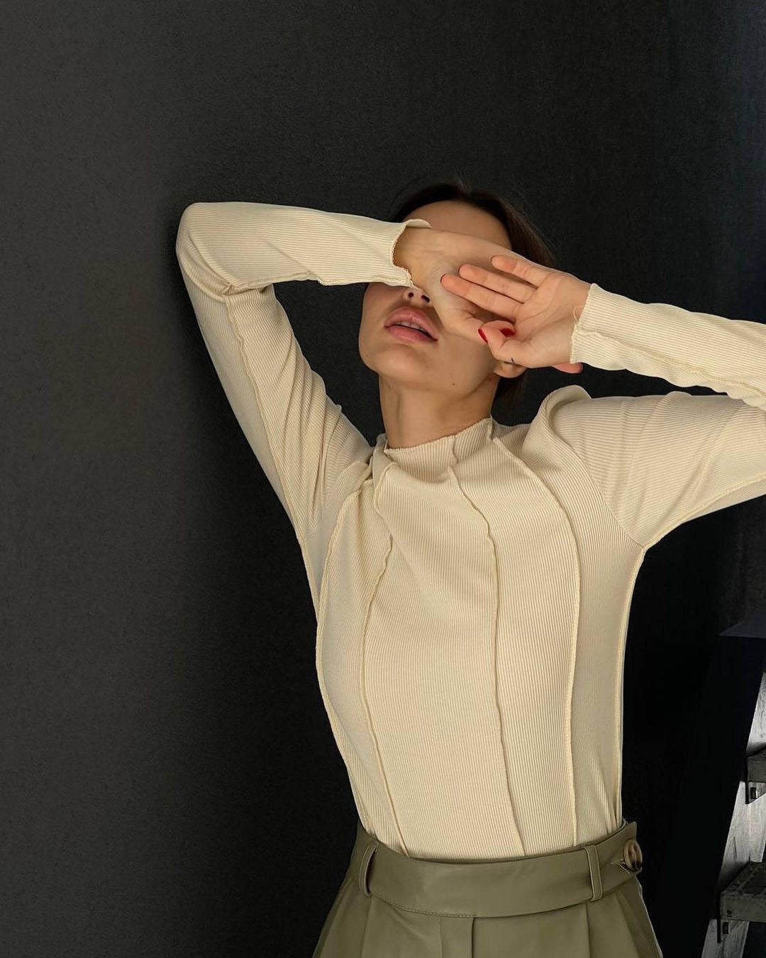 Women’s long sleeve ribbed top in cream with half-zip front and high neck