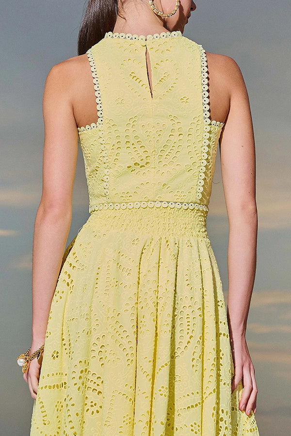 Yellow embroidered high-neck sleeveless crop top and high-waist maxi skirt set with eyelet detail
