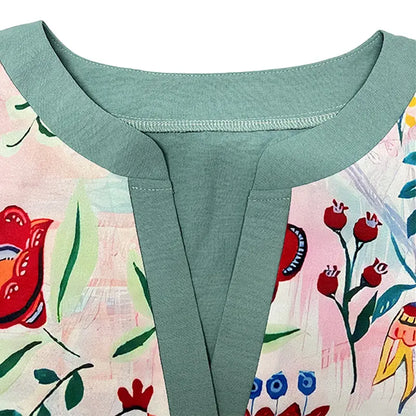 Women’s boat neckline blouse with teal yoke and contrasting floral front