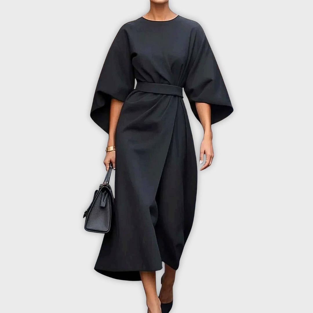 Black belted dolman sleeve midi dress with waist tie and drape.