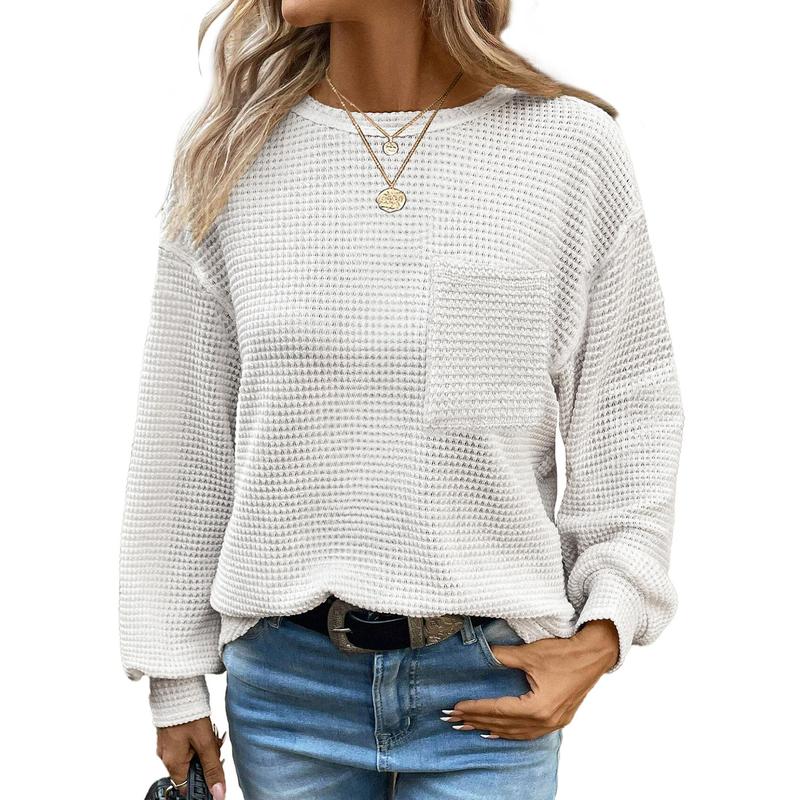 White oversized long-sleeve crewneck blouse with waffle knit texture and chest pocket