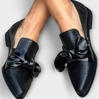 Erica loafers in dark navy with snake-textured uppers and glossy knotted bow