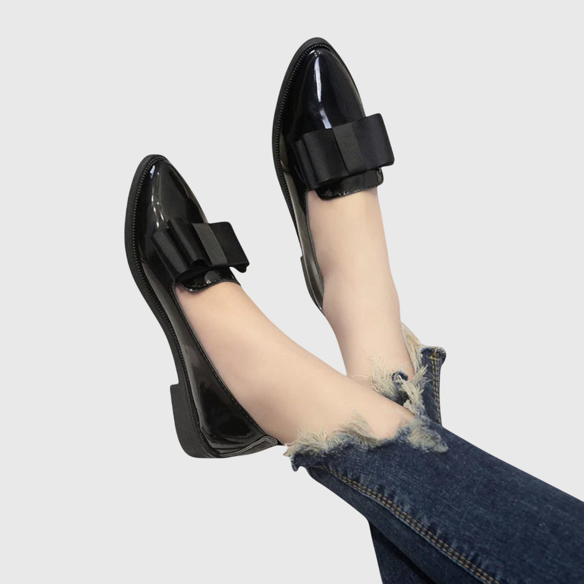 Black patent loafer with wide strap across the top and low block heel