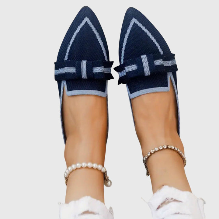 Royal blue slip-on comfy shoes with light trim and side bow detail