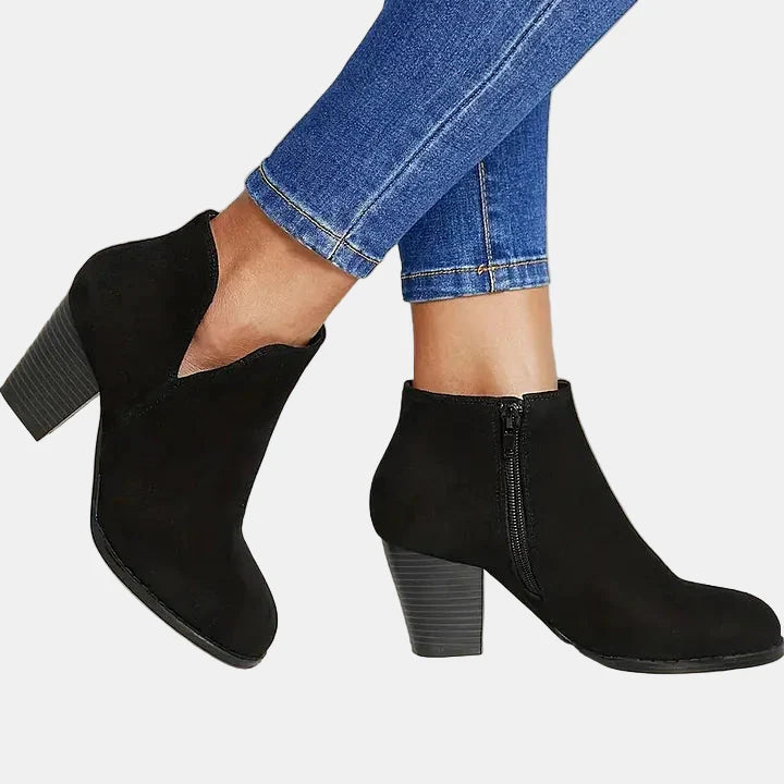 Black suede block-heel ankle boots with side zip and heeled silhouette