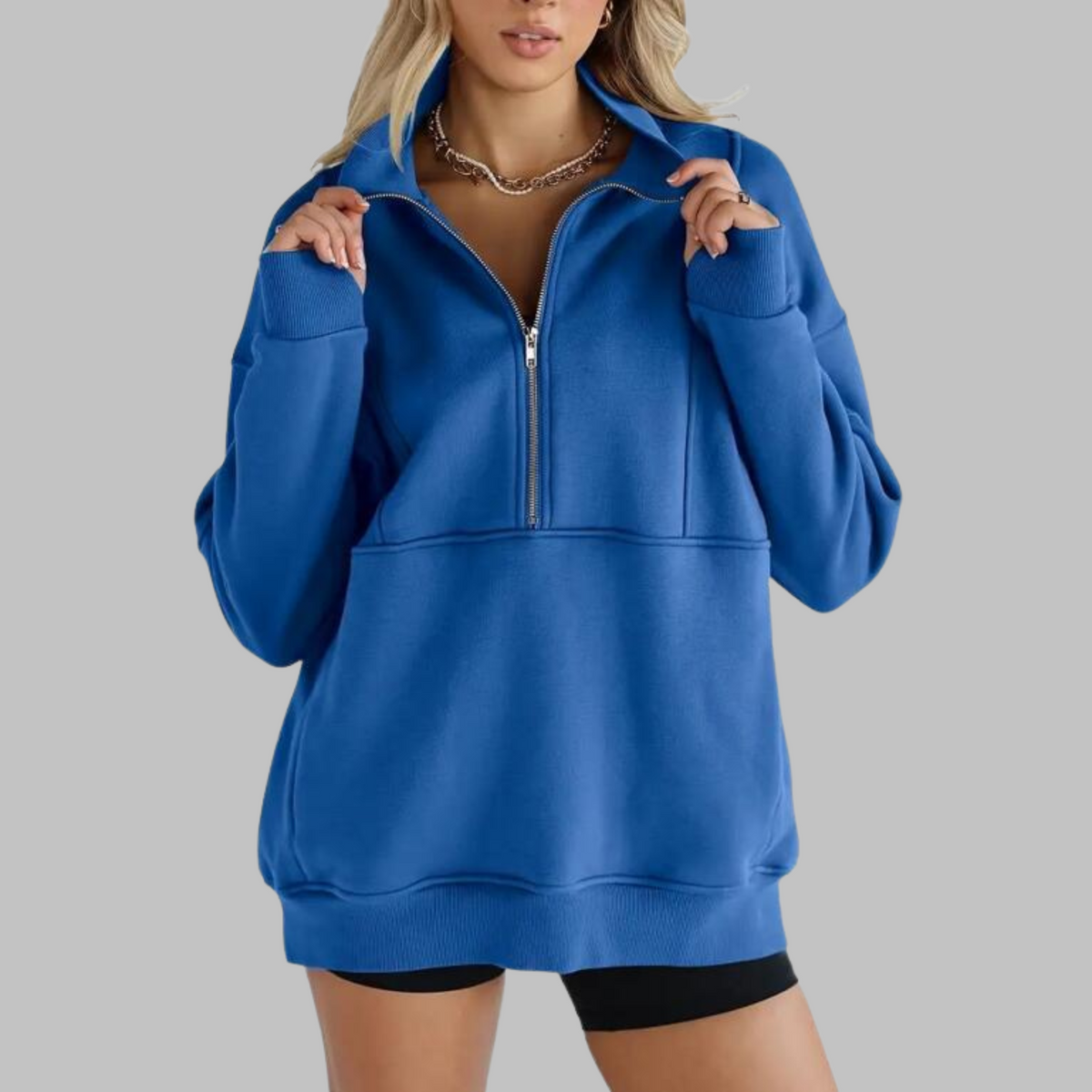 Royal blue oversized half-zip long sleeve sweatshirt with ribbed cuffs, collar, and front pocket