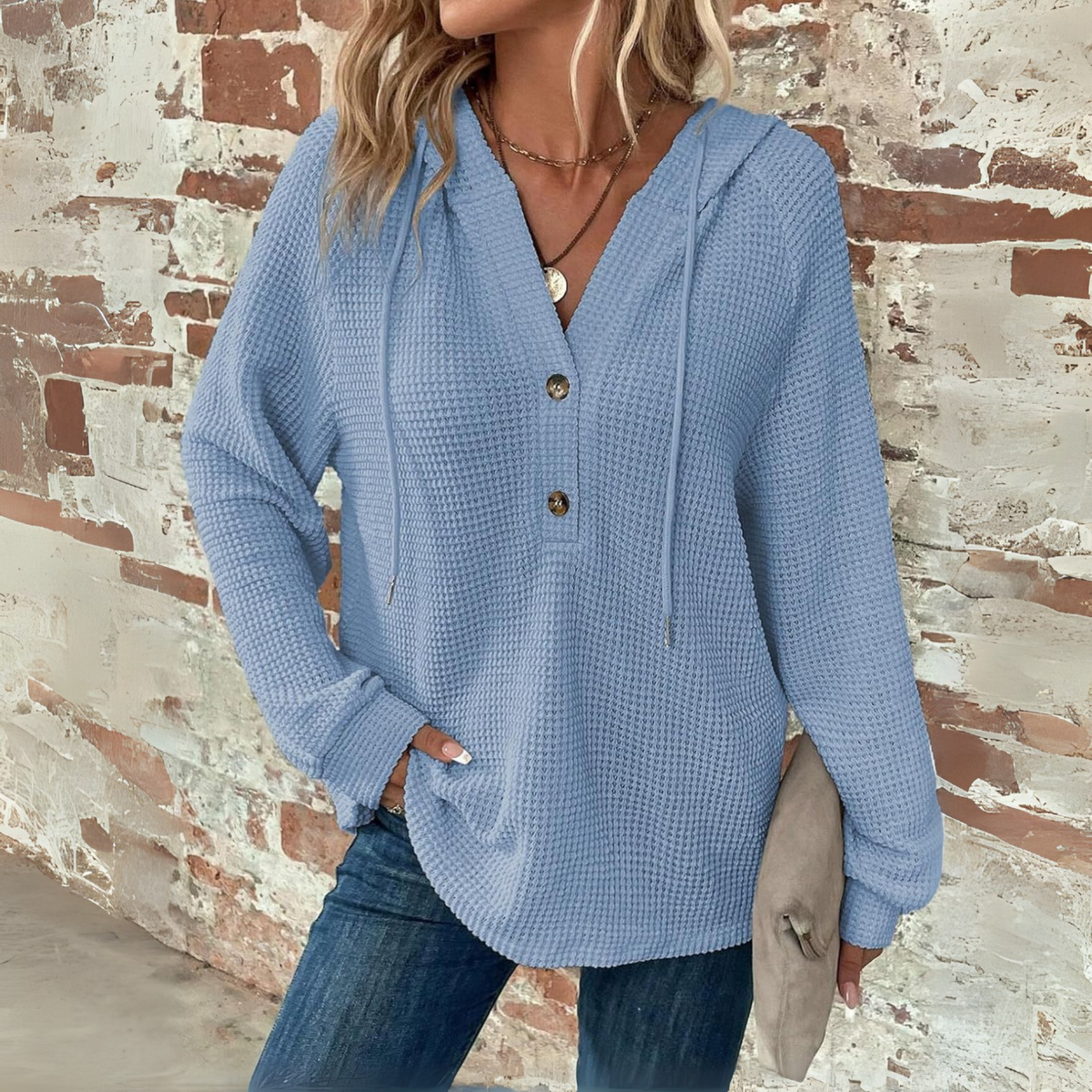 Light blue waffle-knit hoodie with V-neck and button placket, long sleeves