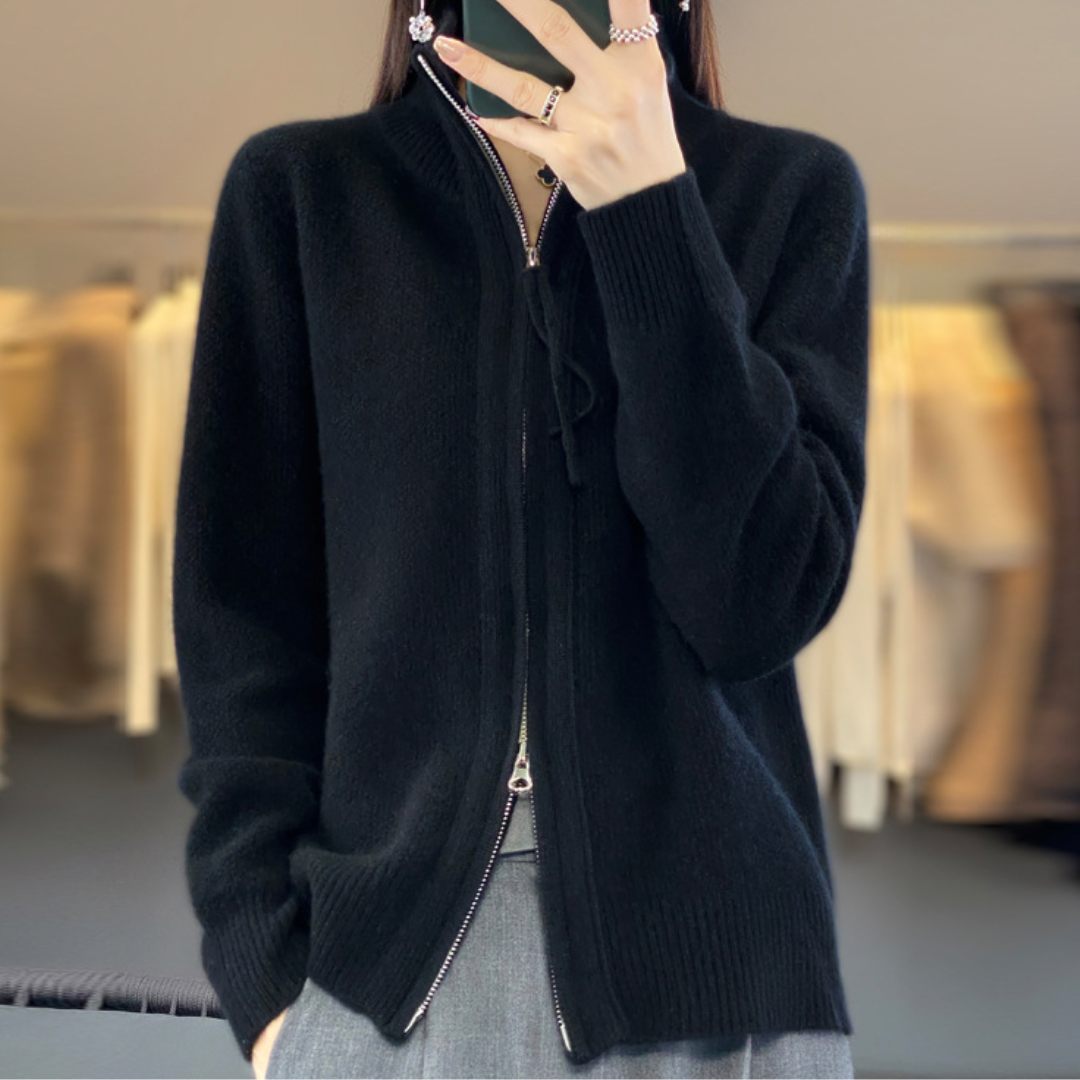 Black zip-up knit sweater with stand collar and long sleeves