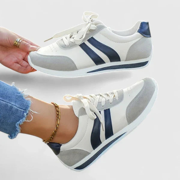 Casual orthopedic shoes, white with navy stripes and gray toe, lace-up close-up