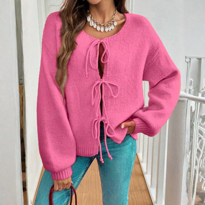 Rose pink tie-front cardigan with round neck and drawstring lacing, long sleeves