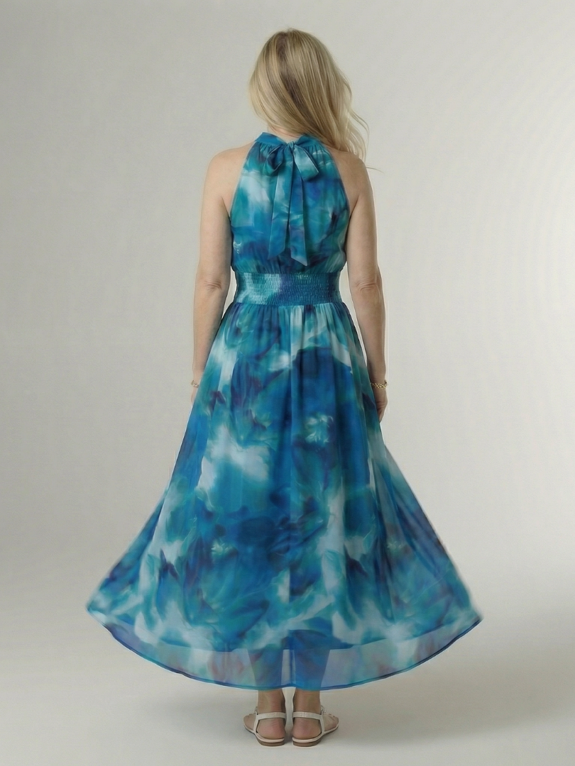 Blue gathered halter midi dress back view with tied neck and smocked waist