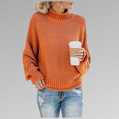 Orange oversized winter sweater, chunky knit, ribbed turtleneck and cuffs