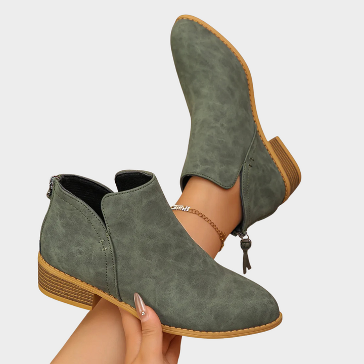 Army green suede ankle boot with side tie and tan textured outsole