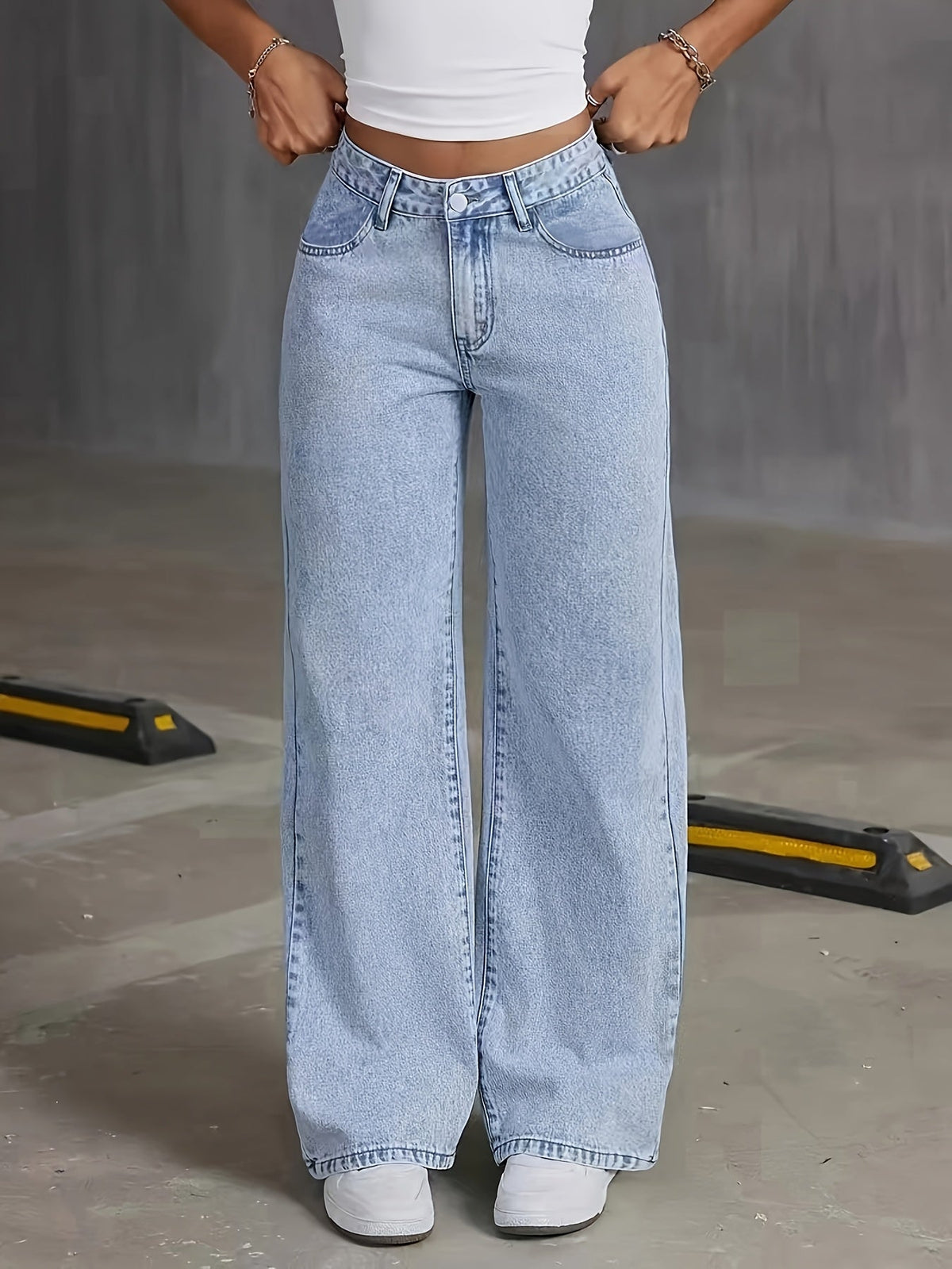 Light blue high-waisted wide-leg denim jeans, button fly and belt loops