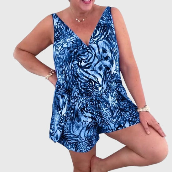 Blue animal-print swimsuit dress with V-neck, sleeveless peplum hem