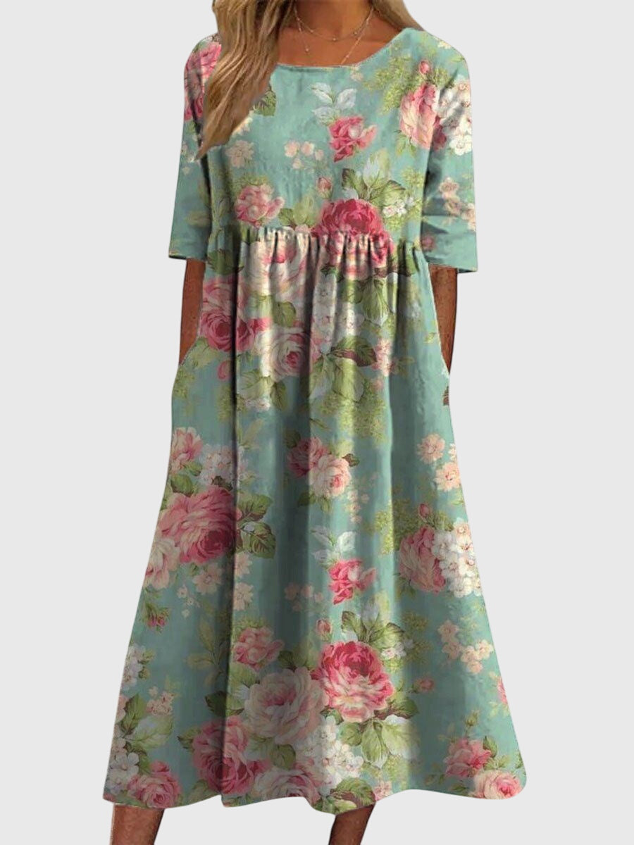 Relaxed midi dress in mint green with pink floral print, short sleeves, gathered waist