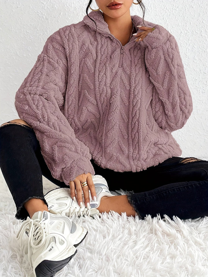 Warm knit quarter-zip sweater in light purple with cable texture, long sleeves, stand collar.