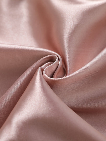 Pink satin fabric close-up with smooth drape and subtle reflective sheen