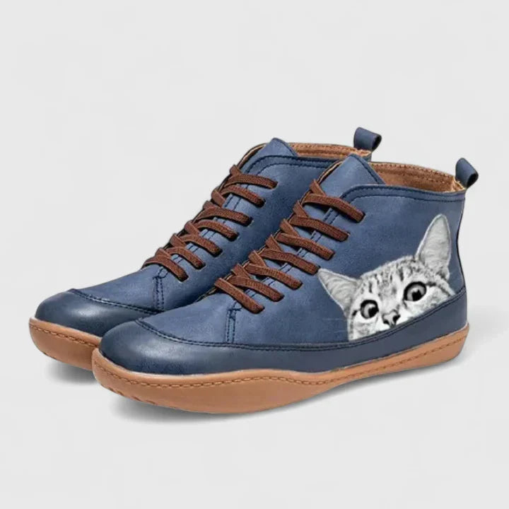 Blue lace-up orthopedic boots with gray cat face patch and cushioned sole