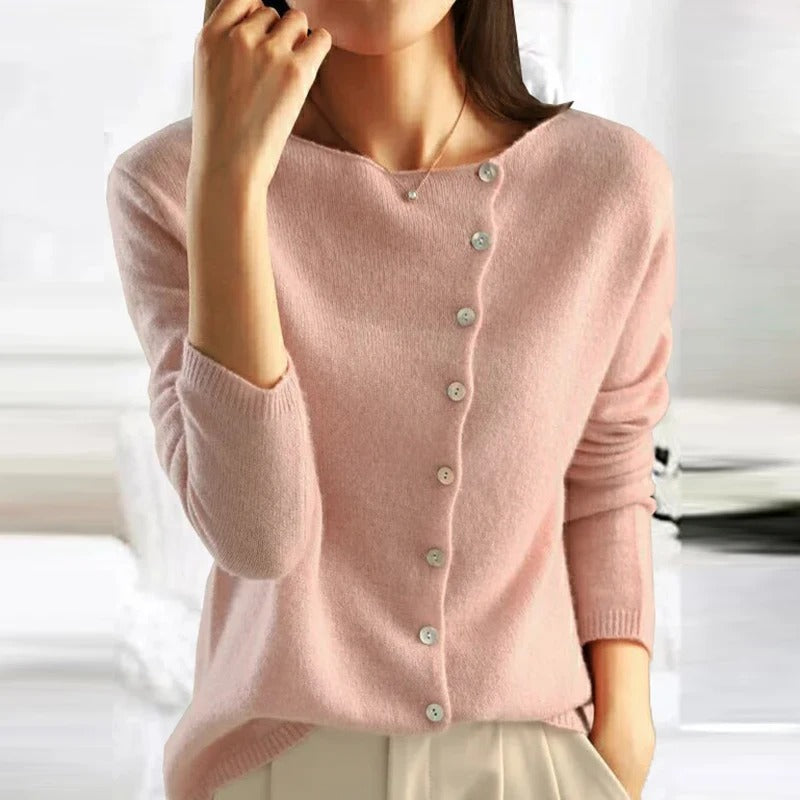 Blush pink buttoned V-neck sweater with long sleeves and ribbed hem