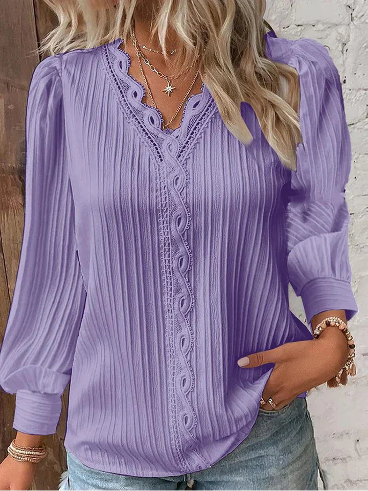 Women’s pleated top in lavender with V-neck lace trim and long sleeves