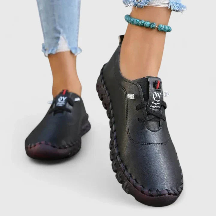 Black leather lace-up casual shoes with contrast stitching and cushioned sole