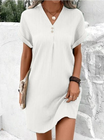 White V-neck layered dress with button placket, short sleeves, and asym hem