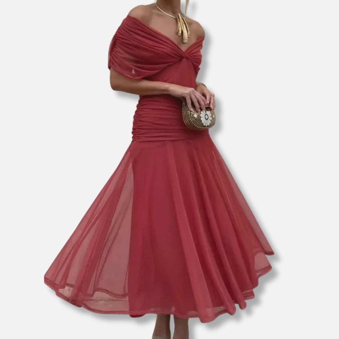 Red wrap-style dress with twisted off-shoulder neckline and flowing midi skirt