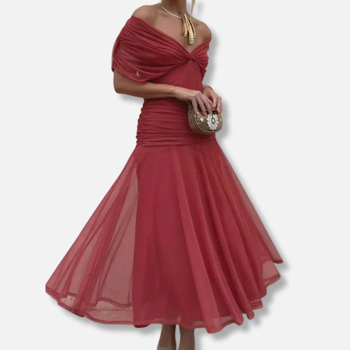 Red wrap-style dress with twisted off-shoulder neckline and flowing midi skirt