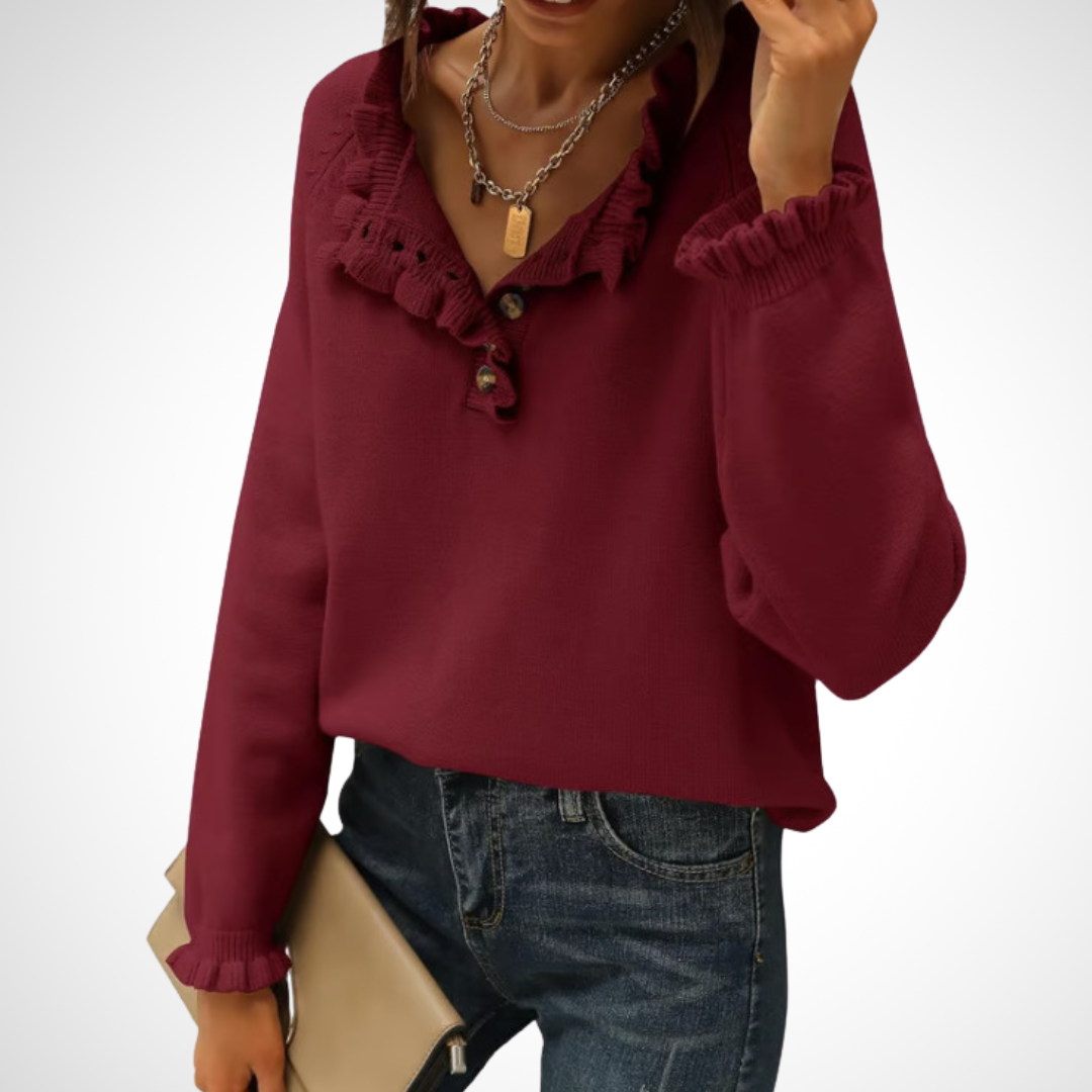 Burgundy long-sleeve pullover sweater with half-button placket and ruffled collar.
