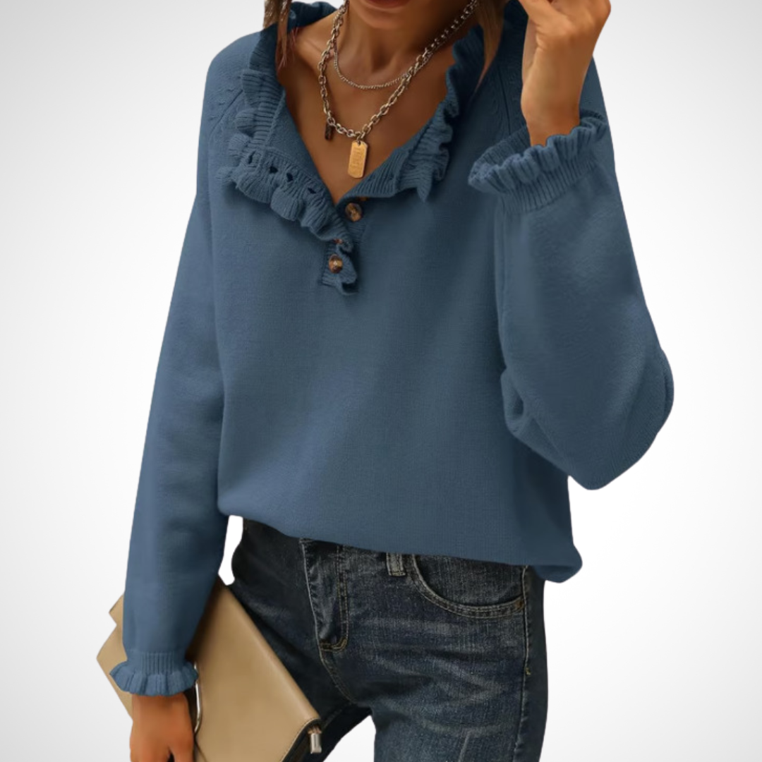 Blue long-sleeve pullover sweater with half-button placket and ruffled collar.